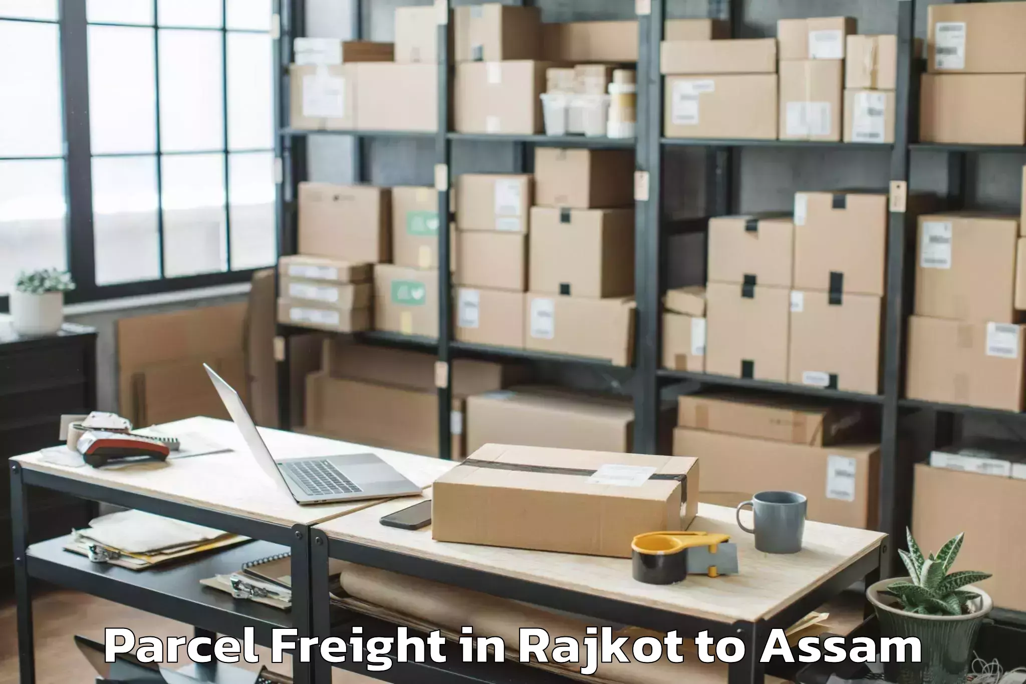 Affordable Rajkot to Jamuguri Parcel Freight